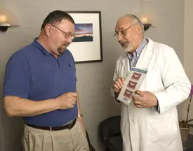Dr Zabek teaching patient